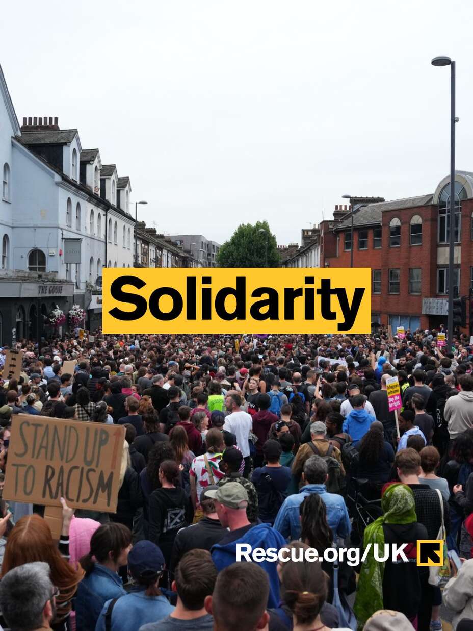 Text reads solidarity over picture of crowds