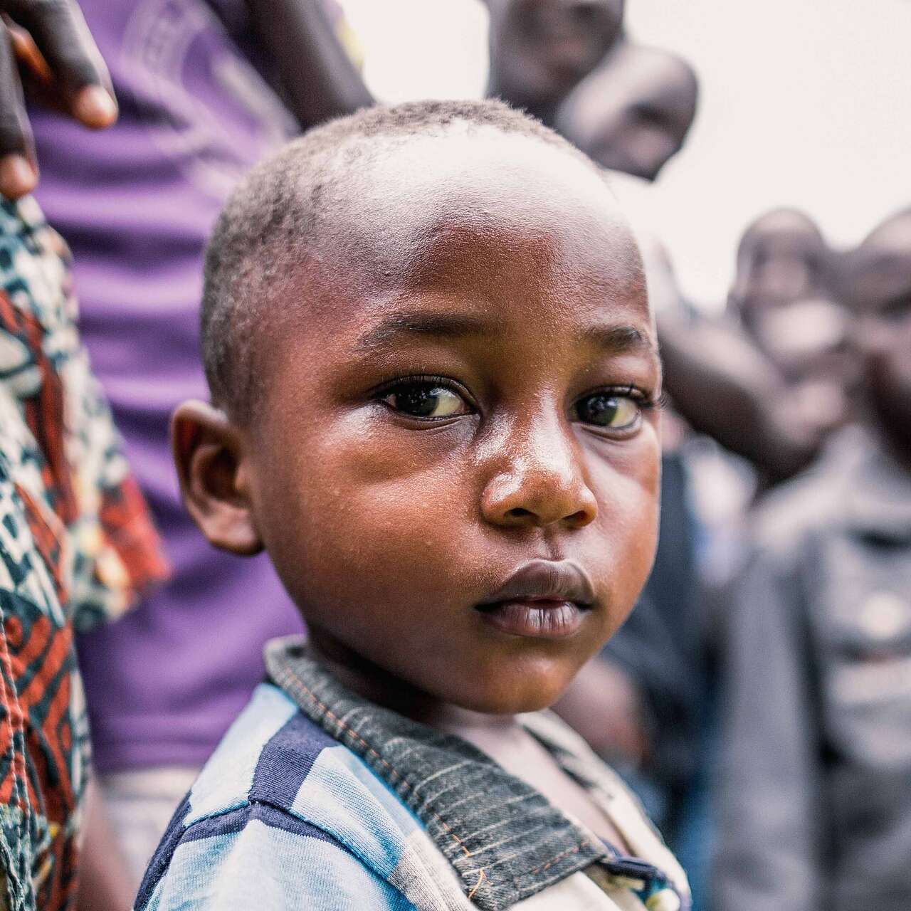 A young boy poses for a photo.