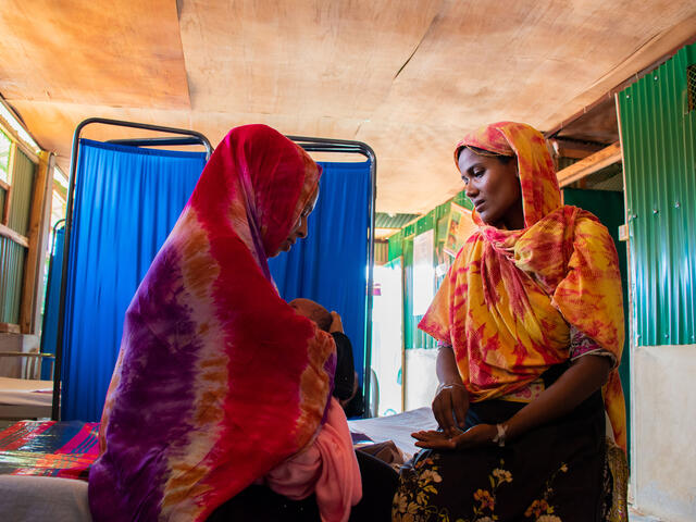 two women in a room talking