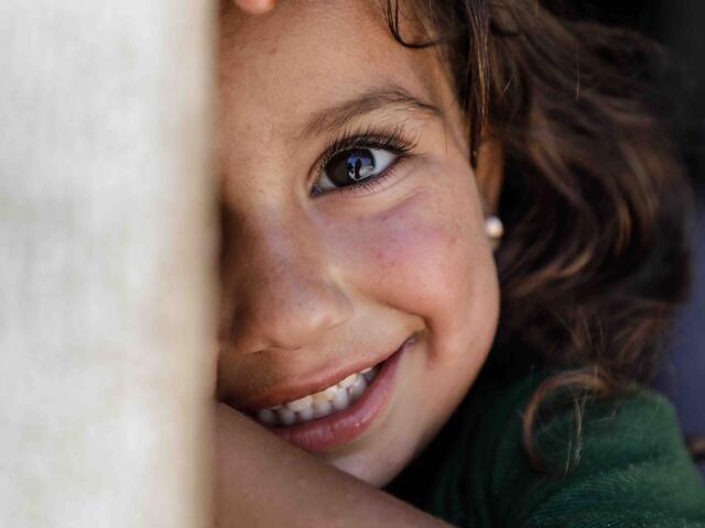 A young girl smiling in the camera