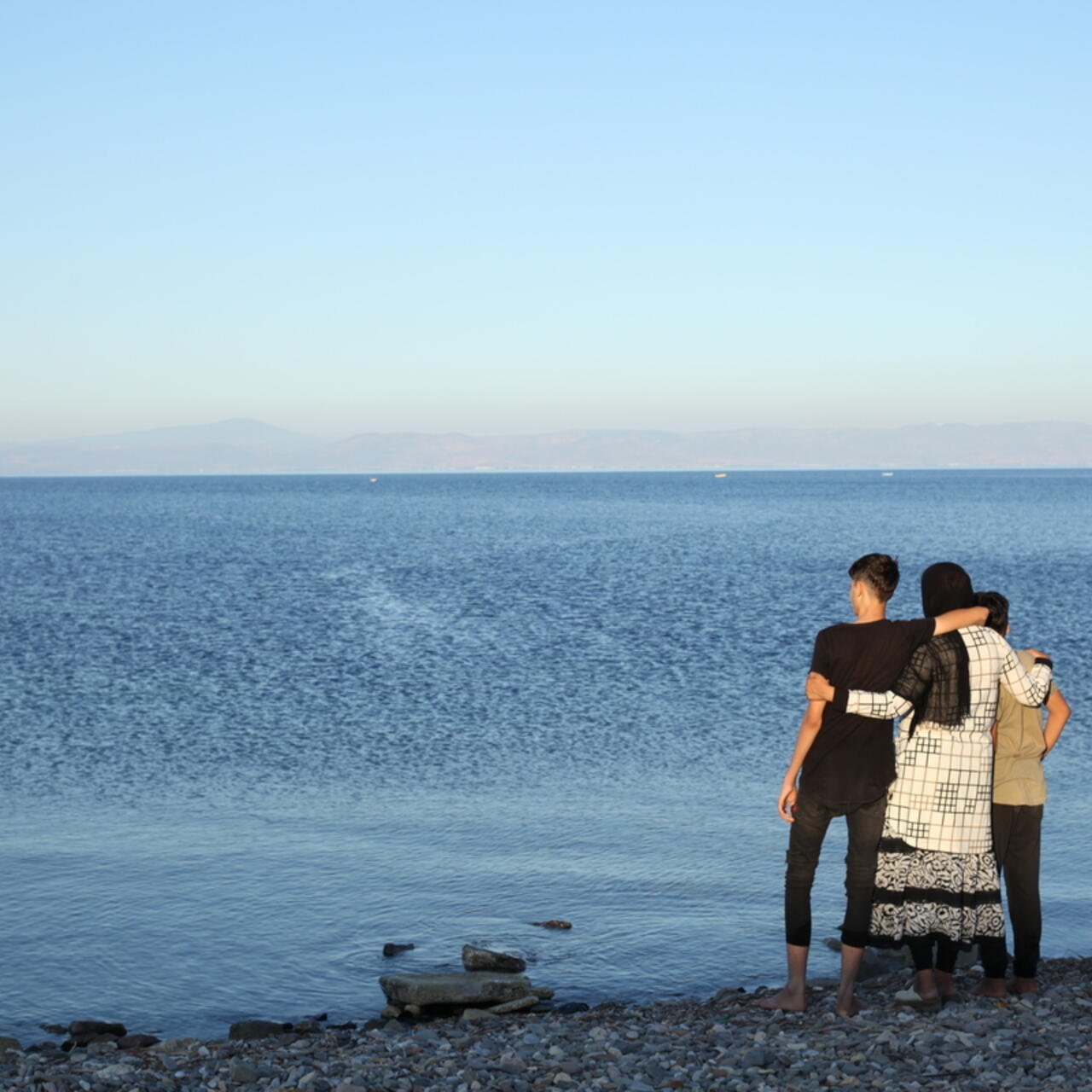 Iranian mother, Wahida with her two sons, Puria, 15, and Neema, 10, on the Greek island of Lesvos.