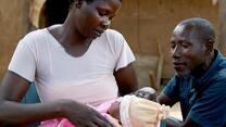 Yete and her husband Matthew with their newborn baby.