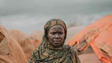 A woman poses for a photo outside in Somalia.