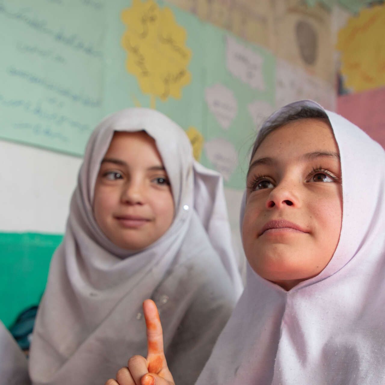 A group of girls study together in a classroom in Afghanistan.