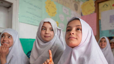 A group of girls study together in a classroom in Afghanistan.