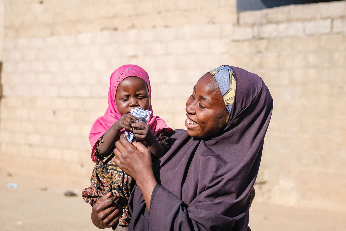 Fatima holds her baby Zara.