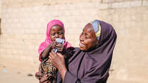 Fatima holds her baby Zara.