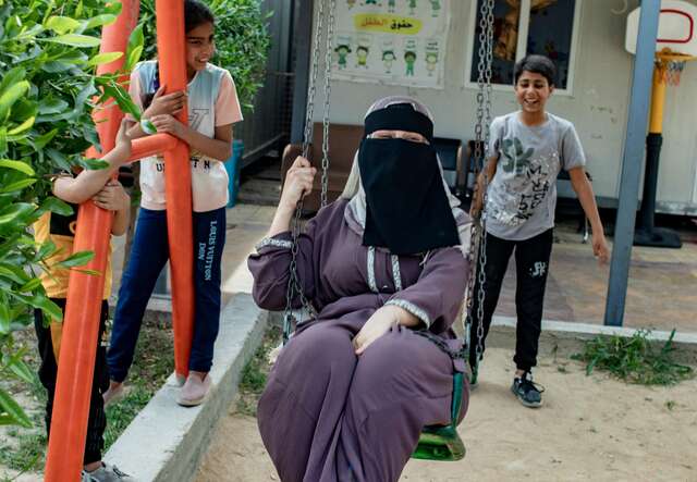  Raqqa, Syria. Farah* (34) is enjoying her time playing with her children 