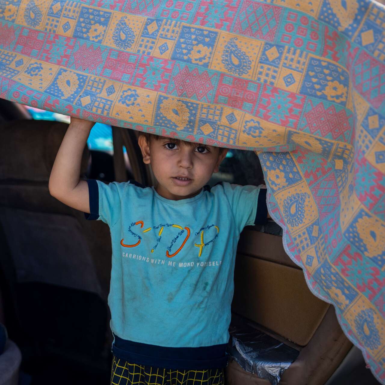 A 5-year-old boy looks out from the car his family is sheltering in on the Corniche after being displaced by Israeli airstrikes, on September 29, 2024 in Beirut, Lebanon.