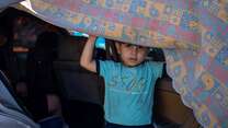 A 5-year-old boy looks out from the car his family is sheltering in on the Corniche after being displaced by Israeli airstrikes, on September 29, 2024 in Beirut, Lebanon.