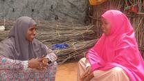 two women sitting and chatting