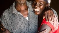 A man and a woman hugging and smiling