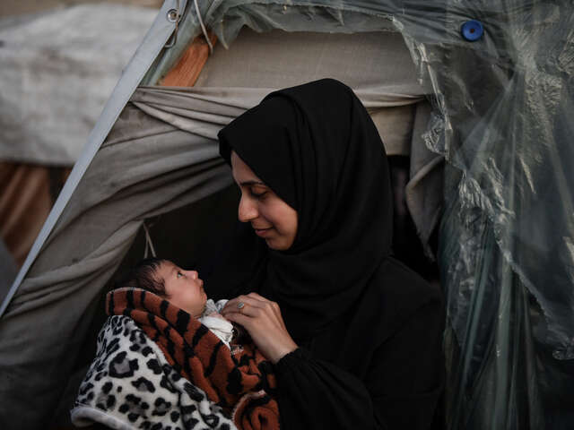 24-year-old Palestinian Safaa holds her baby daughter.