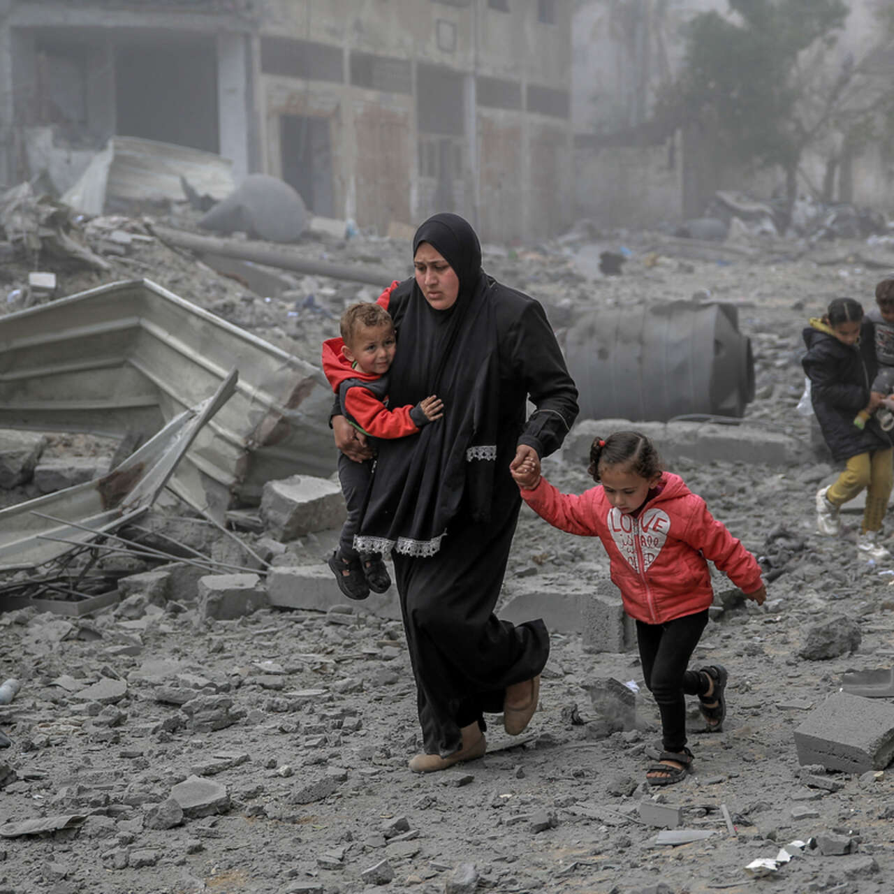 Palestinians flee the area after Israeli bombardment in central Gaza City.