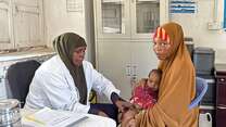 Faduma Ali Adan visits the health facility for her baby girl Maria's immunization appointment, ensuring a healthy start for her.