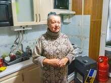 Portrait of Nina in the kitchen of her home in Ukraine.