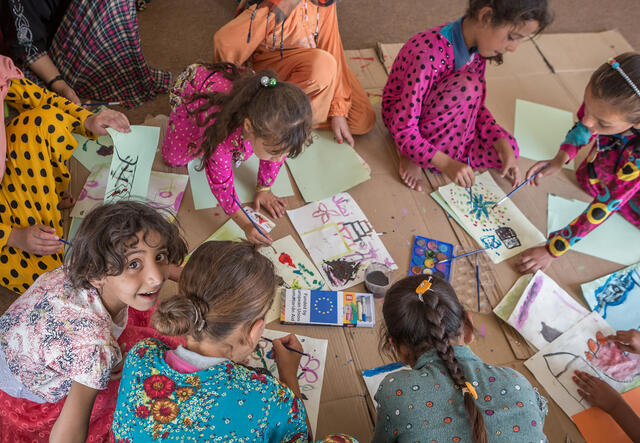 Girls play inside IRC children's safe space in Iraq